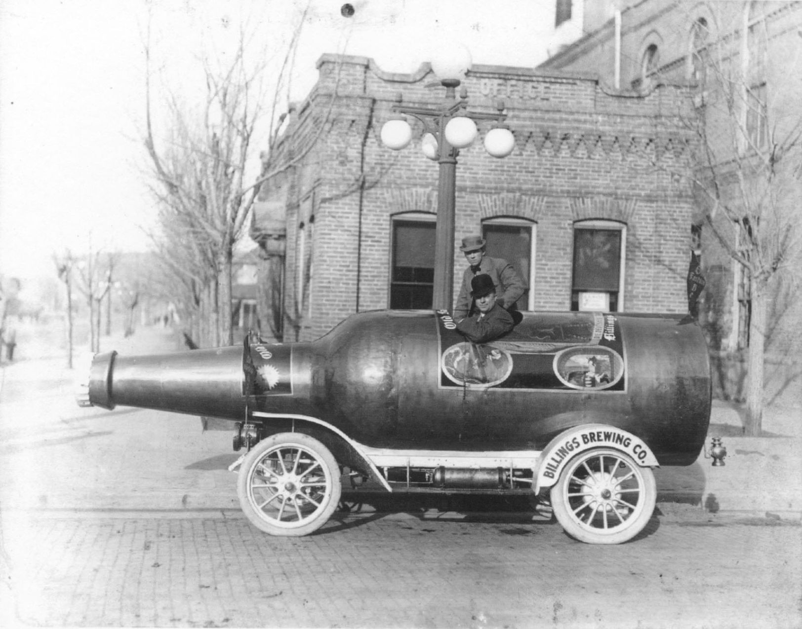 Beer-bottle car beside Billings Brewery